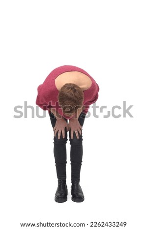 crouched woman looking at the ground searching on white background