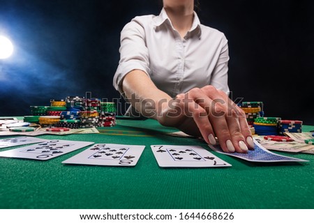 The croupier at the gaming table in the casino.