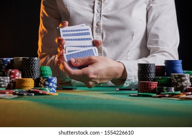 Croupier At The Gaming Table In A Casino. Gaming Business Black Jack, Poker.