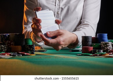 Croupier At The Gaming Table In A Casino. Gaming Business Black Jack, Poker.