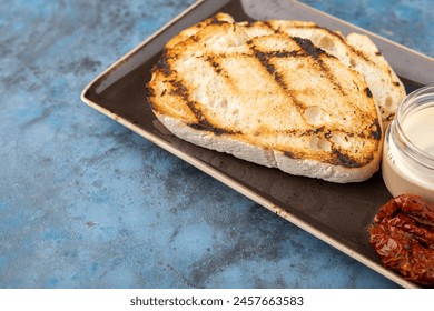 crouton sauce, sun-dried tomato. Serving in a restaurant with the main dish - Powered by Shutterstock