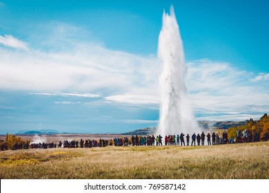 A Crowd Admiring An Eruption Of Stokkur Geyser On Iceland