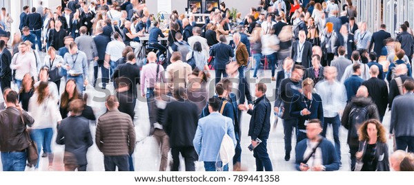 Crowd of anonymous business\
people