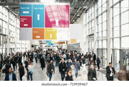 Crowd of anonymous Business people walking at a trade fair