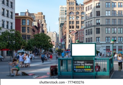 Crowd Of Anonymous People Walking Around A Blank Billboard Sign In Union Square Park Near The 14th Street Subway Station In Manhattan, New York City NYC