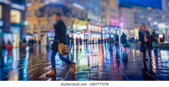 Crowd Of Anonymous People Walking On Busy  City Night Streets