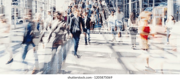 Crowd Of Anonymous People Walking On Busy City Street