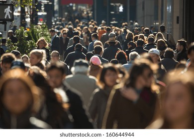 Crowd of anonymous people walking on busy New York City street - Shutterstock ID 160644944