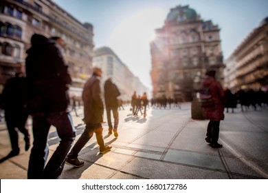 Crowd Of Anonymous People Walking On Busy City Street