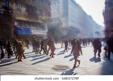 Crowd Of Anonymous People Walking On Busy City Street