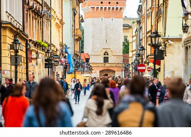 Crowd Of Anonymous People Walking On A Busy Street. Krakow, Old Town, Poland.