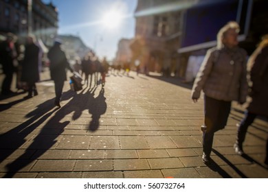 Crowd Of Anonymous People Walking On Busy City Street