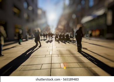 Crowd Of Anonymous People Walking On Busy City Street