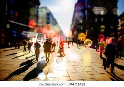 Crowd Of Anonymous People Walking On Busy City Street