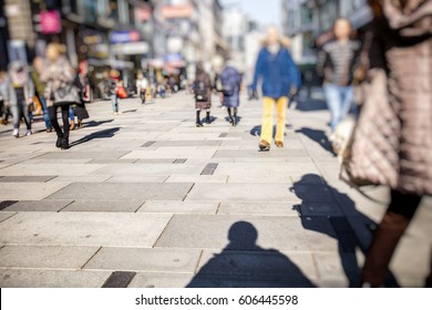 Crowd Of Anonymous People Walking On Busy City Street