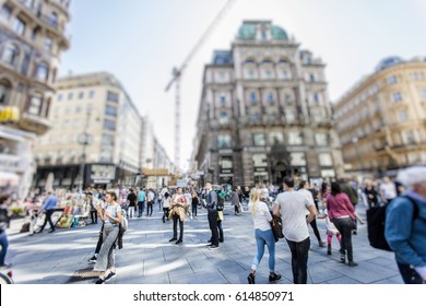 Crowd Of Anonymous People Walking On Busy City Street