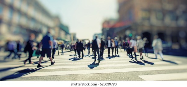 Crowd Of Anonymous People Walking On Busy City Street