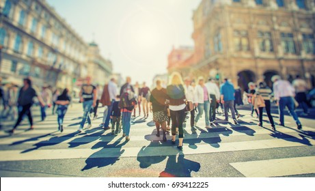 Crowd Of Anonymous People Walking On Busy City Street