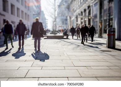 Crowd Of Anonymous People Walking On Busy City Street