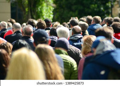 Crowd attending political meeting. Large group of   people as audience to politician's speech outdoors in big screen. - Shutterstock ID 1389425873