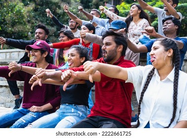 Crowd Bullying Opposite Team Players During On Going Sports Match At Stadium By Showing Showing Thumbs Down Gesture - Concept Of Disapproval, Tournament And Entertainment