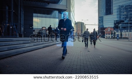 Crowd of Business People Tracked with Technology Walking on Busy Urban Megapolis City Streets. CCTV AI Facial Recognition Big Data Analysis Interface Scanning, Showing Private Information.