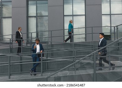 Crowd Business People Walking to Work Upstairs Downstairs. Modern City Busy Life. Business people Outside Office in the City After Work. Business People Concept