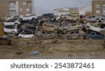 Crowd of cars destroyed by floods in Alfafar, Valencia, Spain. natural disaster.November 2024