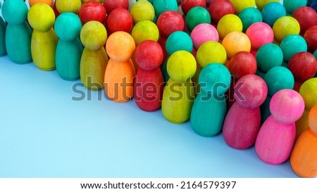 A crowd of colored figures as a symbol of diversity and inclusion.