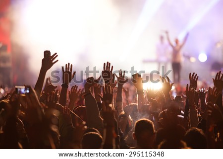 Crowd at concert and blurred stage lights