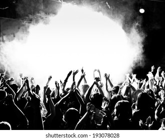 Crowd At A Concert With Hands Up