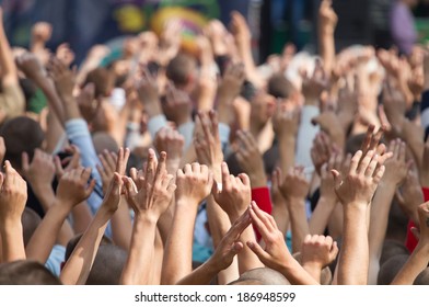 Crowd At A Concert With Hands Up In Outdoor