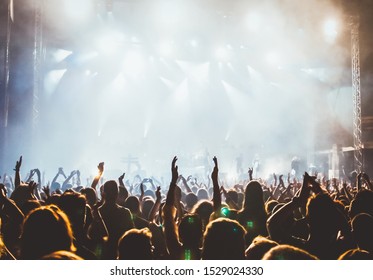 crowd at concert and stage lights with space for text - Shutterstock ID 1529024330