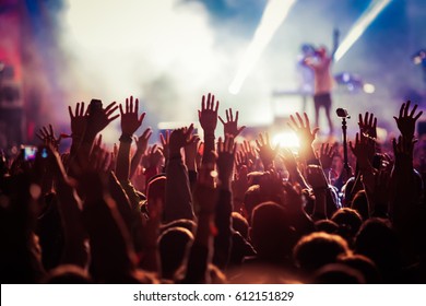crowd at concert - summer music festival - Shutterstock ID 612151829