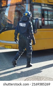 Crowd Control. Rearview Shot Of A Police Man In Riot Gear.