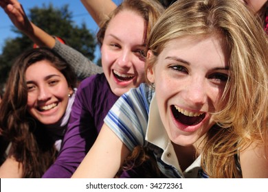 Crowd Of Crazy Teen Girls Celebrating A Famous Star On The Red Carpet