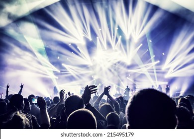 Crowd Enjoying Concert, Happy People Jumping, Large Group Celebrating New Year Holiday, Party Background Fun Concept