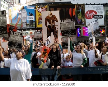 A Crowd Of Excited Fans Downstairs On The Street In Front Of MTV Displaying Signs And Screaming.