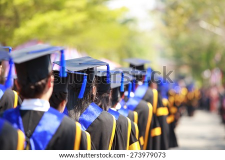 Crowd image of students at graduation ceremony from behind