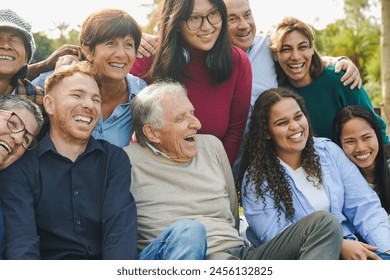 Crowd of multi generational people having fun together at city park - Multiracial community and social inclusion concept - Powered by Shutterstock