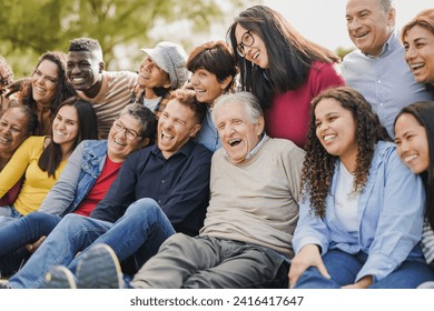 Crowd of multiracial people having fun together at city park - Social gathering and community concept - Powered by Shutterstock