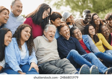 Crowd of multiracial people having fun together at city park - Social gathering, diversity and community concept - Powered by Shutterstock