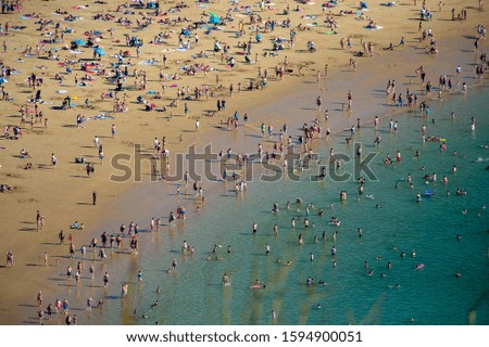 Similar – Aerial View From Flying Drone Of People Crowd Relaxing On Algarve Beach In Portugal