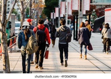 Crowd On Street With Beautiful Evening Light, Tokyo, Japan.