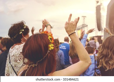 Crowd At An Outdoor Music Festival With Outstretched Arms