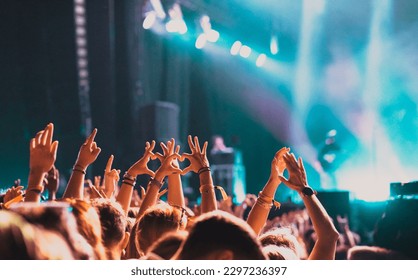 crowd partying stage lights live concert summer music festival - Powered by Shutterstock