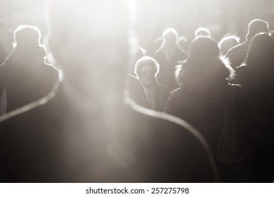 Crowd Of People In Black And White In Backlit