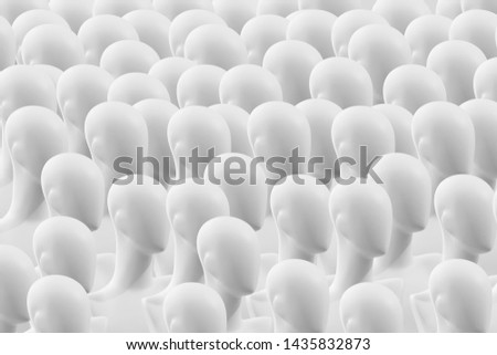A crowd of people dummies. Concept. Many faceless mannequins heads. People are mannequins. Mannequins without eyes. The concept of human society.