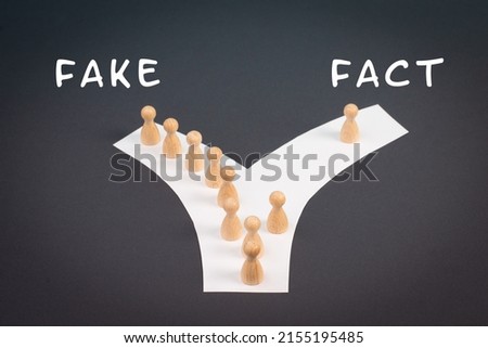 Crowd of people follow the path to the fake information, one thinks different and takes his own way and decisions, propaganda and conspiracy theory concept, media and manipulation issue