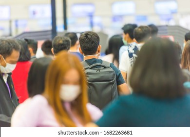 Crowd Of People In Masks Waiting In Airport During Coronavirus Quarantine